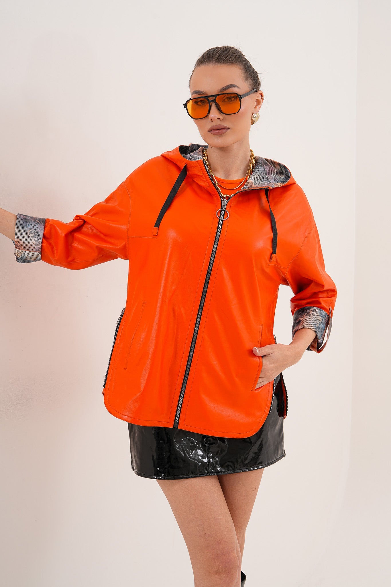The Nyxara Reversible Hooded Orange Leather Women Jacket