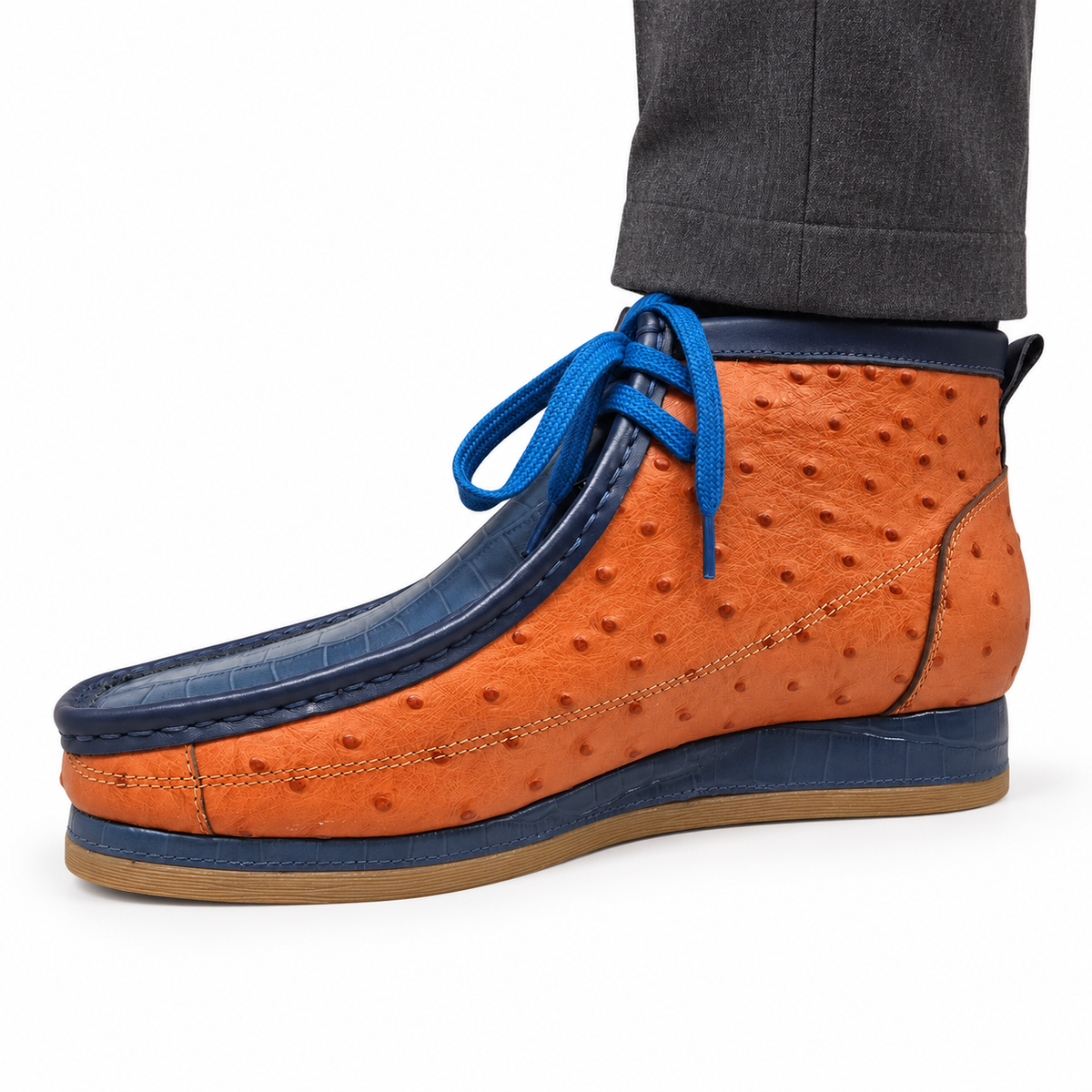 British Walkers New Castle Dual Print Orange and Navy chukka boot, on-foot side view against white; AI-generated styling illustration