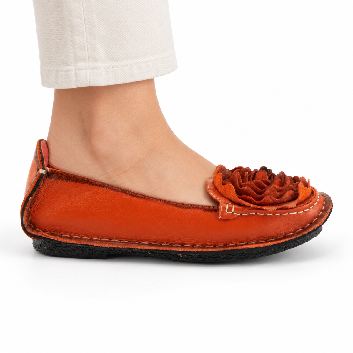 L'Artiste Dezi Orange flat, on-foot side view against white; AI-generated styling illustration