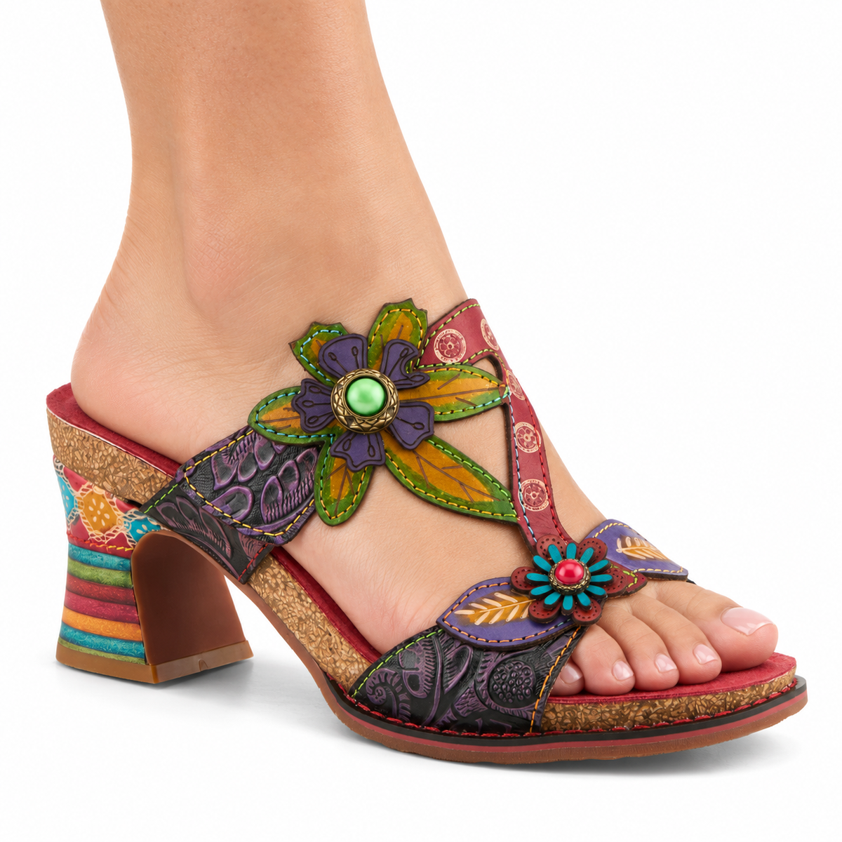 AI-generated on-model image of the L'Artiste Rossie sandal in Red Multi, with floral and leaf appliques and a multicolored sculpted heel, on a white background.