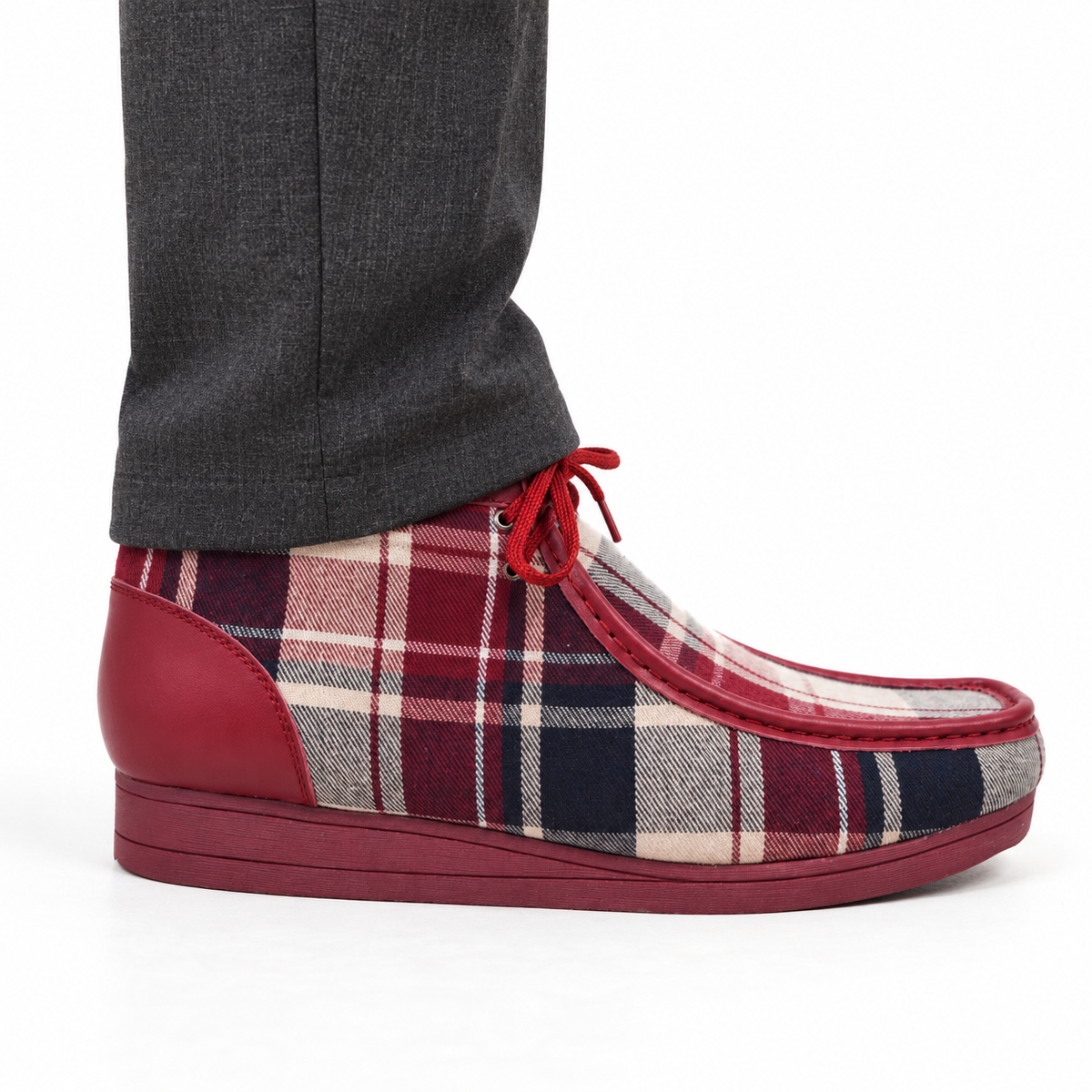 AI-generated on-model styling view of a British Walkers New Castle Limited Plaid Burgundy Multi Plaid ankle boot, worn with charcoal trousers on a white studio background.