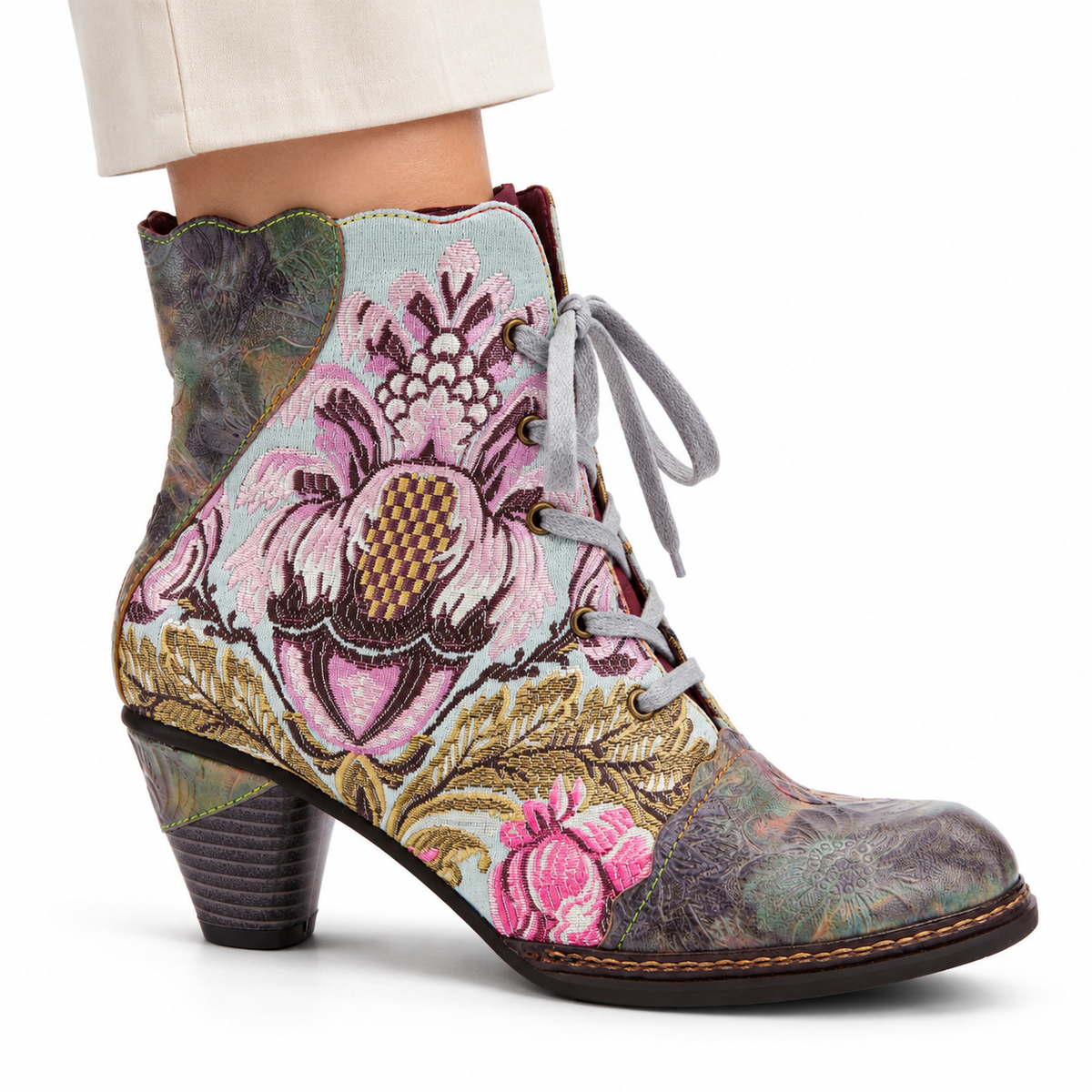 AI-generated styling view of L'Artiste Siren women's Mint Green / Multi floral lace-up ankle boot, outer side on a model against white.