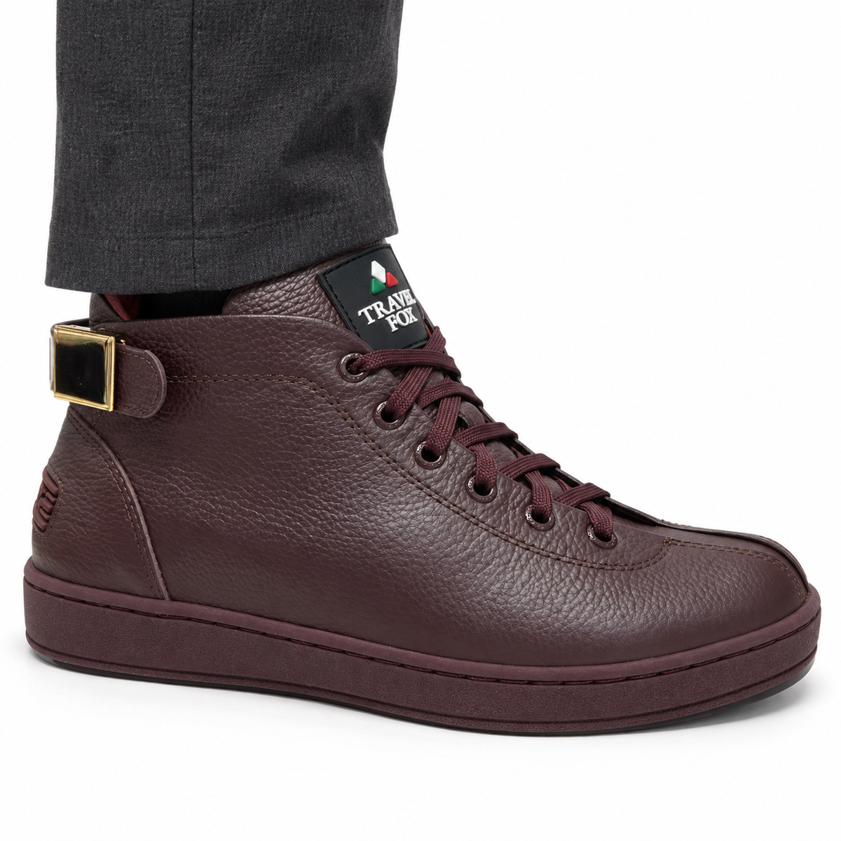 AI-generated on-model styling view of a Travel Fox Malibu Burgundy 91560144 mid-top shoe, worn with charcoal trousers on a white studio background.