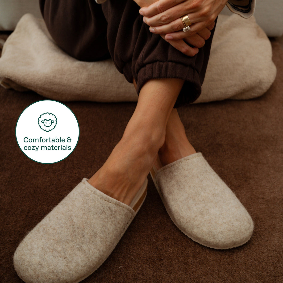 Fulton House Shoe slippers in Beige worn while seated