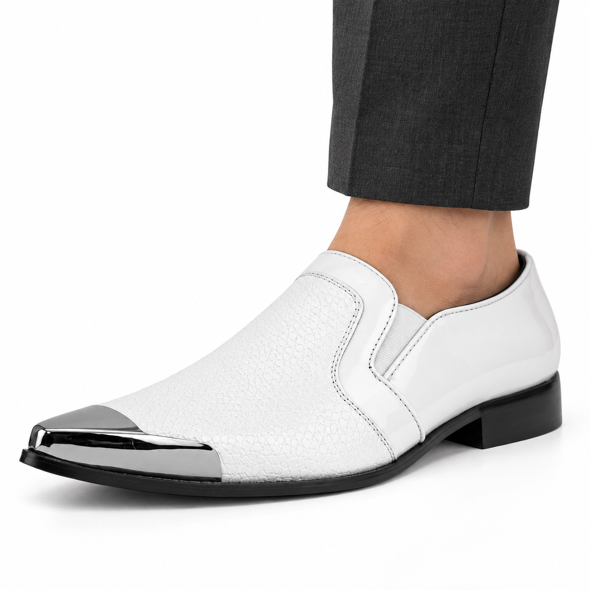 AI-generated styling illustration of an Amali Davis white slip-on shoe with silver-tone toe cap worn with charcoal trousers on a white background; fine texture and reflections are illustrative, refer to original product photos.