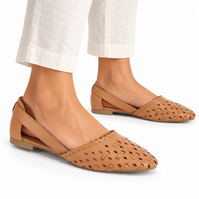 AI-generated styling illustration of an adult model wearing the Spring Step Delorse flats in Camel; original product photo shows actual item details.