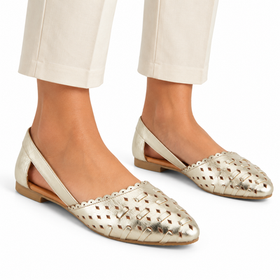 AI-generated styling illustration of an adult model wearing the Spring Step Delorse flats in Gold; original product photo shows actual item details.