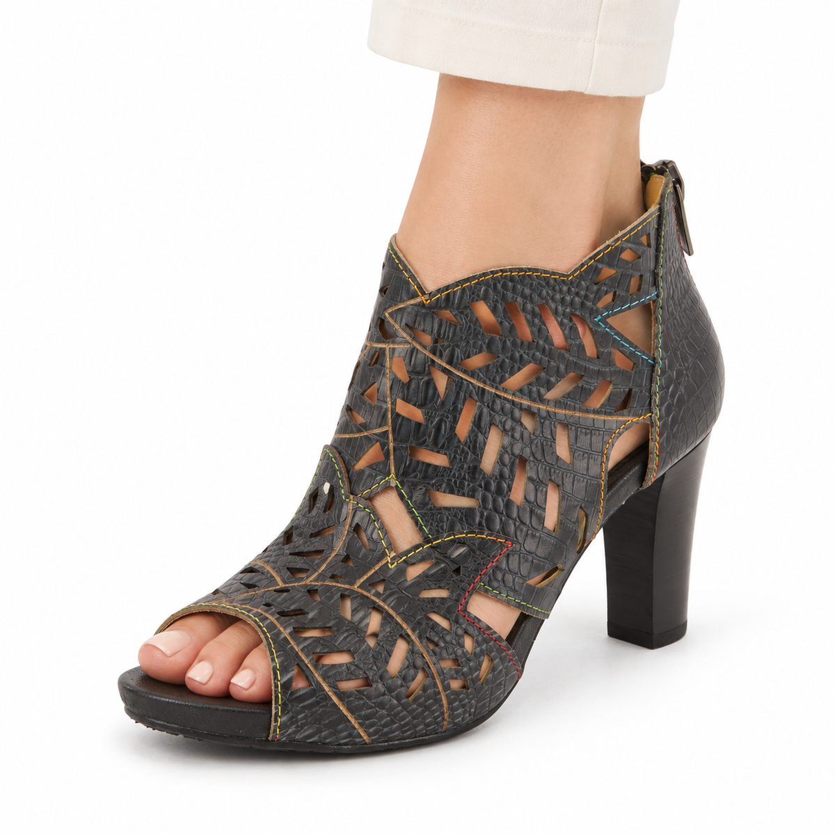 L'Artiste Amora in Charcoal, cutout sandal worn on a model against white; AI-generated styling illustration