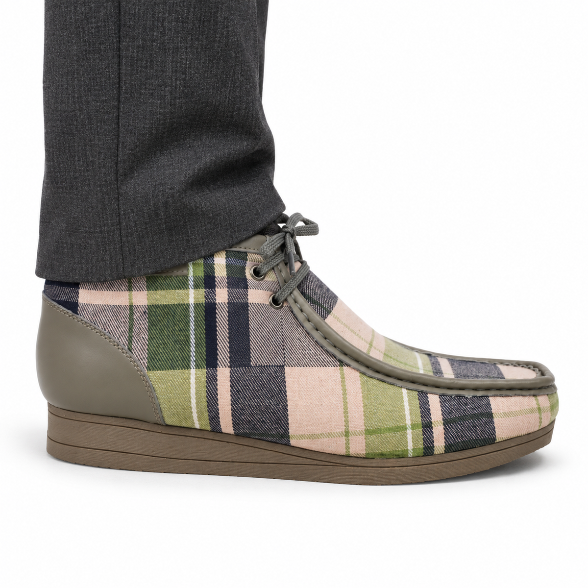 AI-generated on-model styling view of a British Walkers New Castle Limited Plaid Gray Multi Plaid ankle boot, worn with charcoal trousers on a white studio background.
