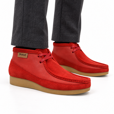 AI-generated on-model styling view of British Walkers New Castle Red suede and leather ankle boots, worn with charcoal trousers on a white studio background.