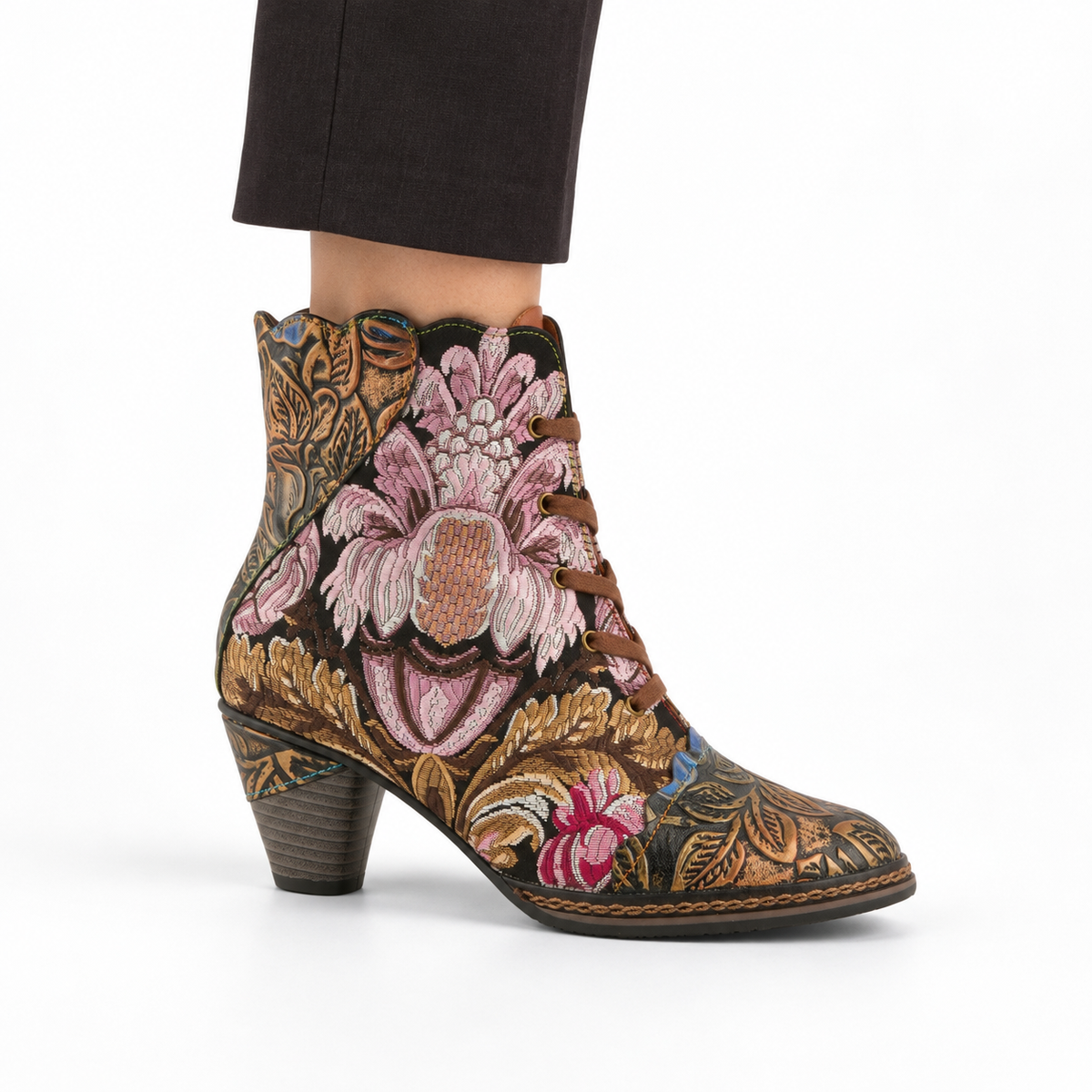 AI-generated styling view of L'Artiste Siren women's Bronze Multi floral lace-up ankle boot, outer side on a model against white.