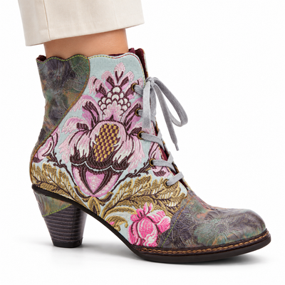 AI-generated styling view of L'Artiste Siren women's Mint Green / Multi floral lace-up ankle boot, outer side on a model against white.