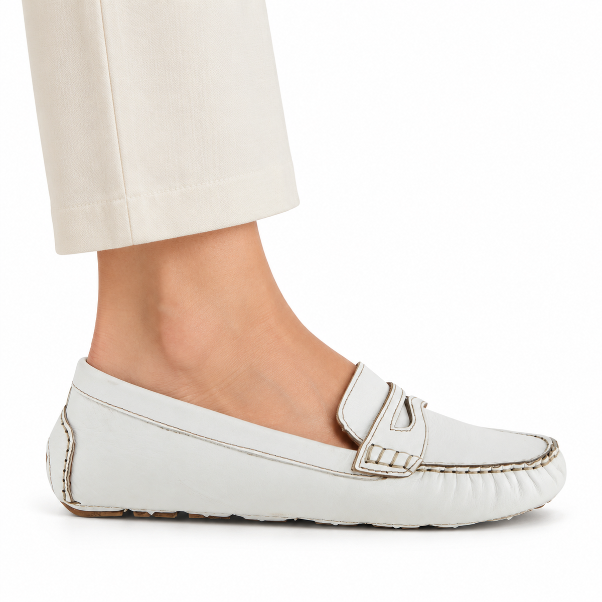 Spring Step Audette penny loafer in White, side view on foot against white; AI-generated styling illustration