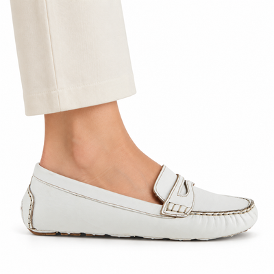 Spring Step Audette penny loafer in White, side view on foot against white; AI-generated styling illustration