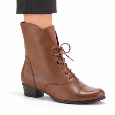 AI-generated on-model styling illustration of a medium brown Spring Step Galil boot on a white background.