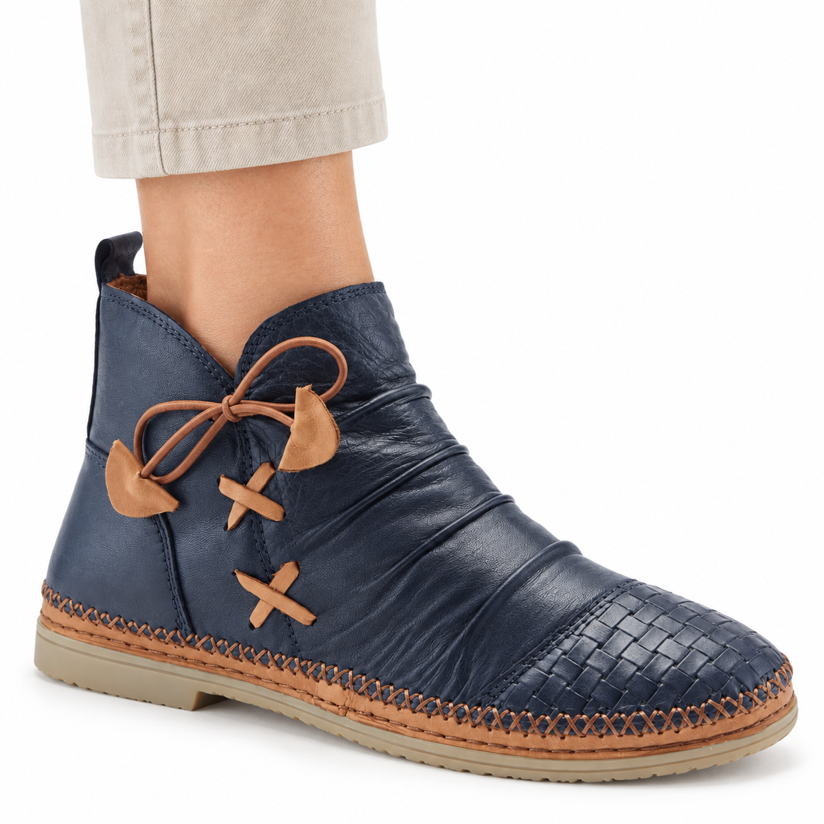 AI-generated on-model styling illustration of a navy Spring Step Pomeroy boot on a white background.