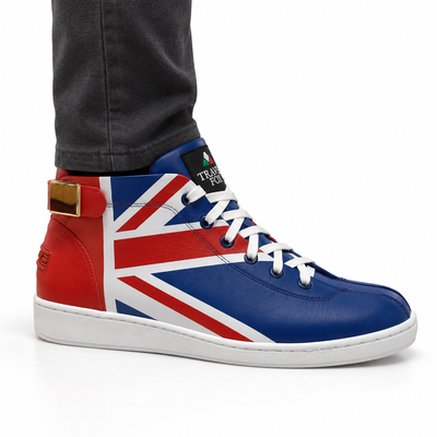 AI-generated on-model styling view of a Travel Fox Union Jack 915601-21 red, white and blue mid-top shoe, worn with charcoal trousers on a white studio background.